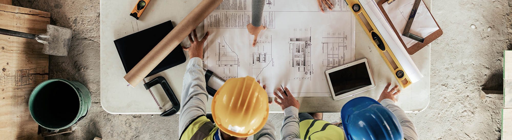Top view, construction workers or blueprint planning in house, home or office building in real estate, property or architecture innovation. Men, engineering woman or construction site people or ideas